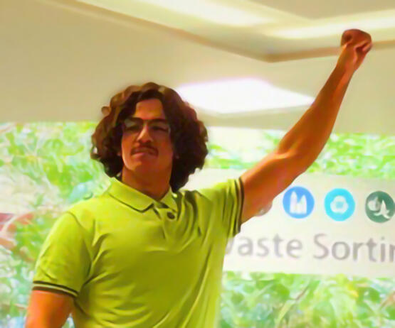 A man stands with his fist raised in the air