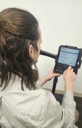 A person looking at a tablet
